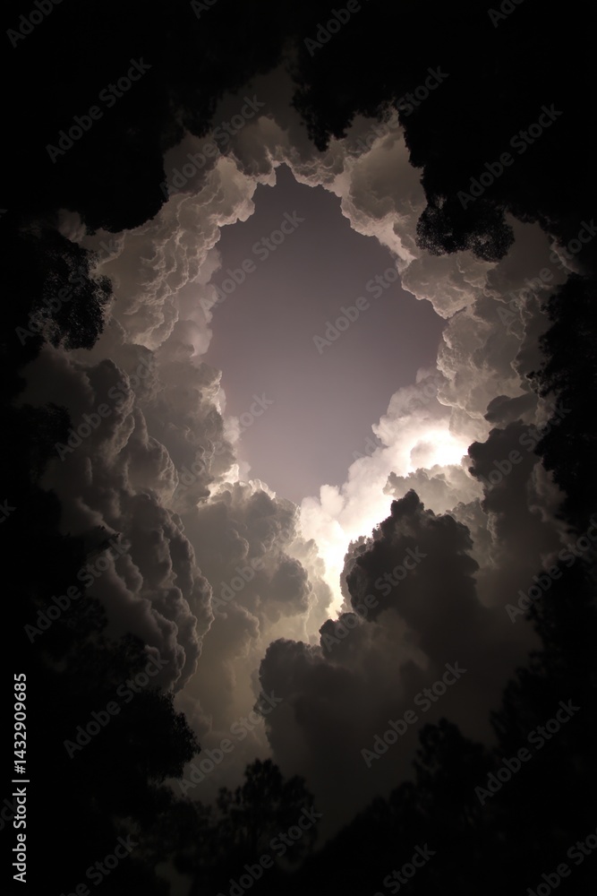 Poster dramatic cloudscape with a hole in the sky creating a surreal and captivating atmosphere perfect for