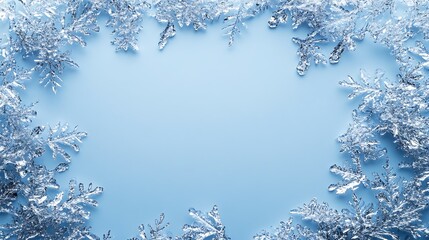 Frozen snowflakes frame, light blue background