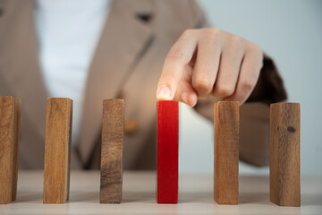 insurance with hands protect domino. Businessman hands stop dominoes falling in business crisis. business risk control and planning and strategies to run prevent insurance businesses.