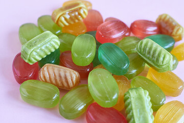 Lollipop caramel on a pink background.