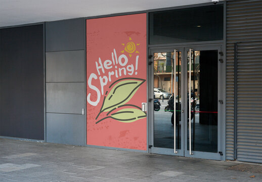 Vertical Poster Mockup displayed next to the entrance door of a building.