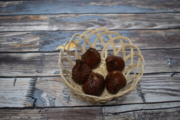 Kelubi fruit is served in a natural bamboo basket for a rustic look.