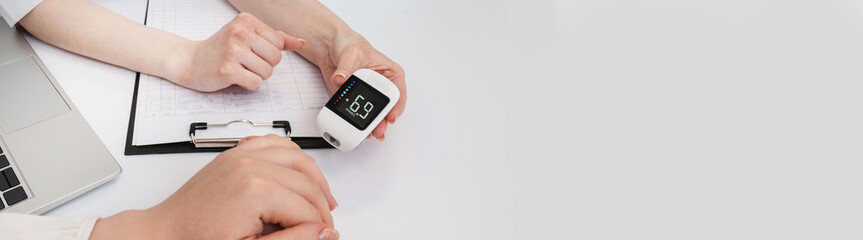 Doctor shows glucometer to patient with bad high blood sugar level. diabetes prevention. Closeup of...