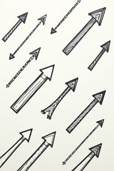 Hand-drawn upward arrows pattern in a sketchy style in black and white representing growth and direction [with copy space]