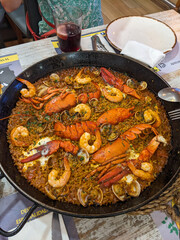 A vibrant paella dish overflowing with fresh seafood, a culinary delight ready to be served and shared.