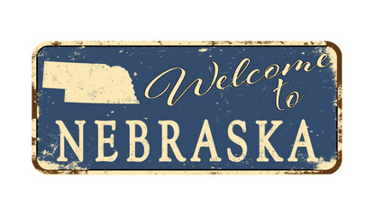 Welcome to Nebraska. A worn blue plaque with the name and outline of the state. Welcome inscription on the road sign