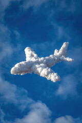 Dreamy Cloud-Shaped Airplane Against a Bright Blue Sky with Whimsical Fluffy Clouds