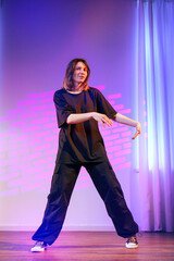 Dance performance showcasing contemporary style with vibrant lighting and expressive movement