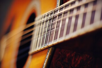 Music teacher giving online guitar lesson from home