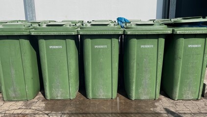 green garbage bins for leftovers, sustainable waste separation