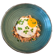 Pork Firer rice topped with fried egg and chopped green onions isolated white background 
