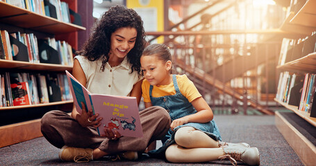 Child, library or teacher reading book for learning, development or storytelling in school. Teaching, tutor or woman with girl, smile or kid for literature lesson, fairy tale or education support