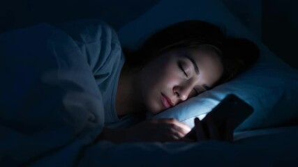 Person using smartphone while lying in bed at night, blue light illuminates face in dark bedroom - digital device habits and sleep disruption - Powered by Adobe