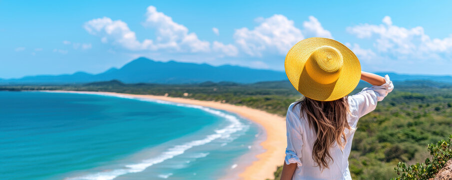 woman in yellow hat enjoys scenic view of beach and mountains, embodying sense of tranquility and summer bliss - Powered by Adobe