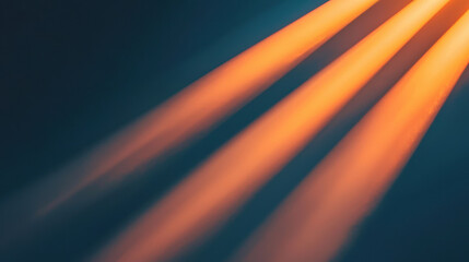 Naklejka premium Soft beams of orange light create warm atmosphere against dark background, evoking sense of tranquility and calmness