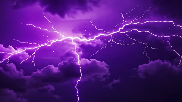 Powerful thunderstorm with lightning in night sky illuminate the clouds with purple-blue hues
