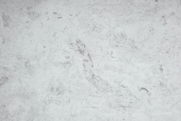 Smooth light gray concrete surface with subtle texture and patterns