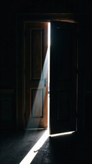 Open wooden door with light and shadow play creating a mysterious and suspenseful atmosphere, ideal for dramatic storytelling