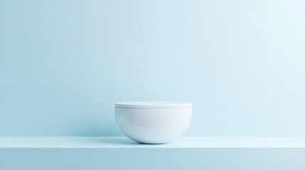 Empty white bowl on a light blue surface