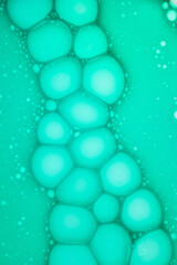 Beauty product swatch sample. Liquid emerald green liquid soap gel with bubbles cosmetic smudge texture transparent background