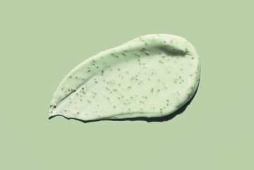 Cosmetic green cream scrub for face, body or scalp texture background. beauty product smudge smear swatch isolated on green sage color