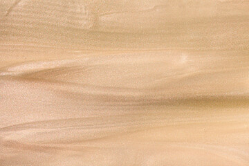 Cosmetic luminous beige shimmer glitter product body lotion bronzator or liquid tights. Pink nude lightening foam beauty product