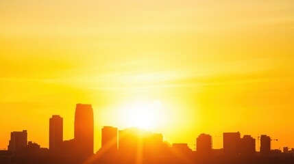 City skyline silhouette at sunset with vibrant orange hues and clear sky, peaceful ambiance