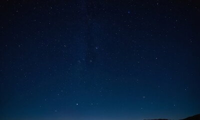 Fototapeta premium Cosmic canvas: A breathtaking display of stars in the night sky