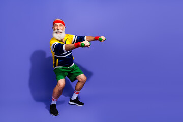 Active man exercising with dumbbells in retro style outfit featuring vibrant colors on a purple background