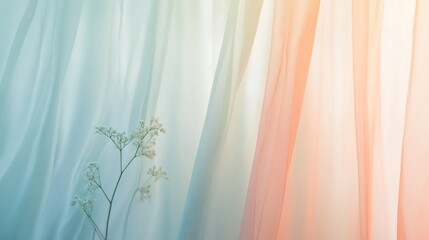 Soft, pastel-colored sheer fabric with subtle light and a small sprig of flowers