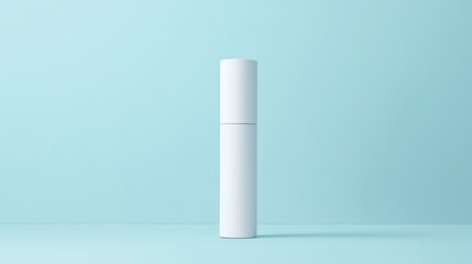 Empty white cosmetic tube on a light teal background