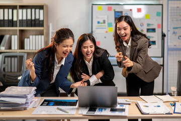 Three women are laughing