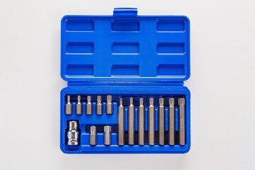 A set of single-sided chrome steel bits in a blue plastic box 