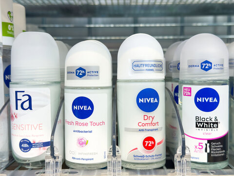 Variety of antiperspirant deodorants on display with multiple brands and fragrance options