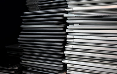 Electronic waste and e-waste - stack of laptops to be discarded