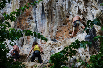 Thai people climber and foreign mountaineer travelers sport rock climbing at Dragon Crest Precipice...