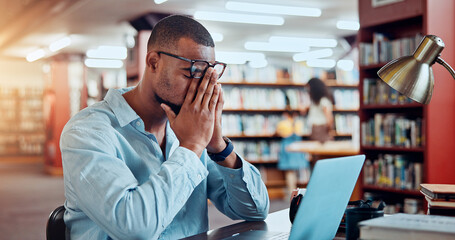 Black man, laptop and pain in library for education, research or project deadline for university...