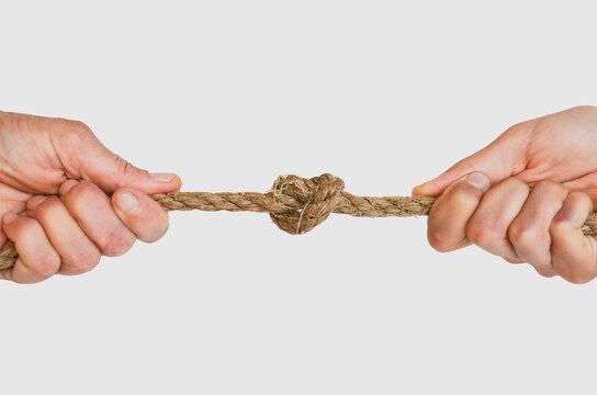 Man and woman plays Tug of War.