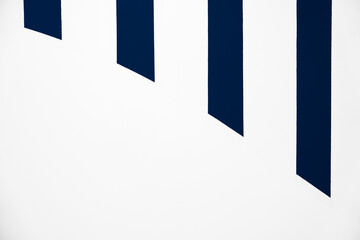 Blue Striped lines on White Background with Concrete wall texture with vertical pattern straight blue paint with copy space for Trendy fashion design background,Minimalist abstract background concept