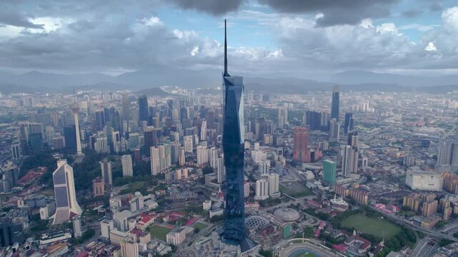 Panorama of Kuala Lumpur, Malaysia on a sunny day. Aerial drone view of Merdeka 118 tower megastructure