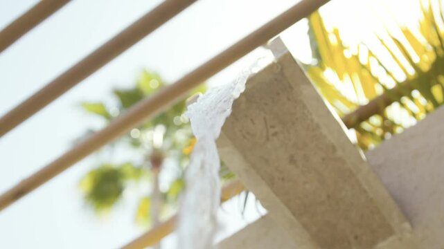 Water flowing from concrete gutter in tropical setting
