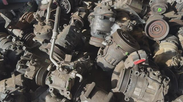 Warehouse of broken compressors for car air conditioner. Car air conditioner repair.