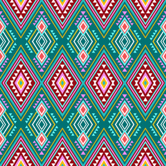 Colorful geometric diamond pattern repeats seamlessly with ethnic and tribal influences creating a vibrant and eye catching design element.