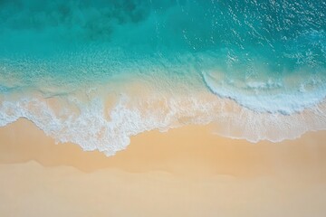 High-angle view of a tranquil beach with turquoise waves lapping at the shore.