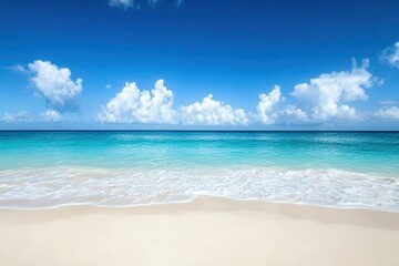 Fototapeta premium Tranquil beach scene with azure water and fluffy clouds.