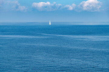 Panoramic high level view over blue tranquil Adriatic sea near Polignano a Mare, Italy with one...