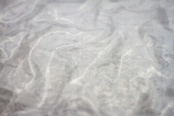 Extreme macro of plastic bubble wrap texture. Selective soft focus, shallow depth of field. Abstract dreamy background