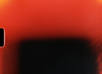 Light leak creating red and black gradient on film frame edge