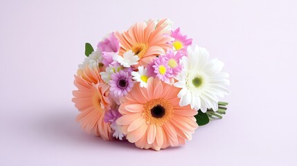 A vibrant and delicate bouquet of pastel gerbera daisies and other mixed flowers arranged beautifully against a soft pink background.