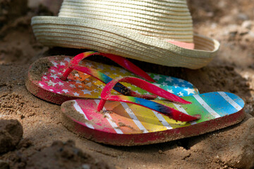 Summer vacation concept: flip-flops and strawn hat. summer in the village. High quality photo